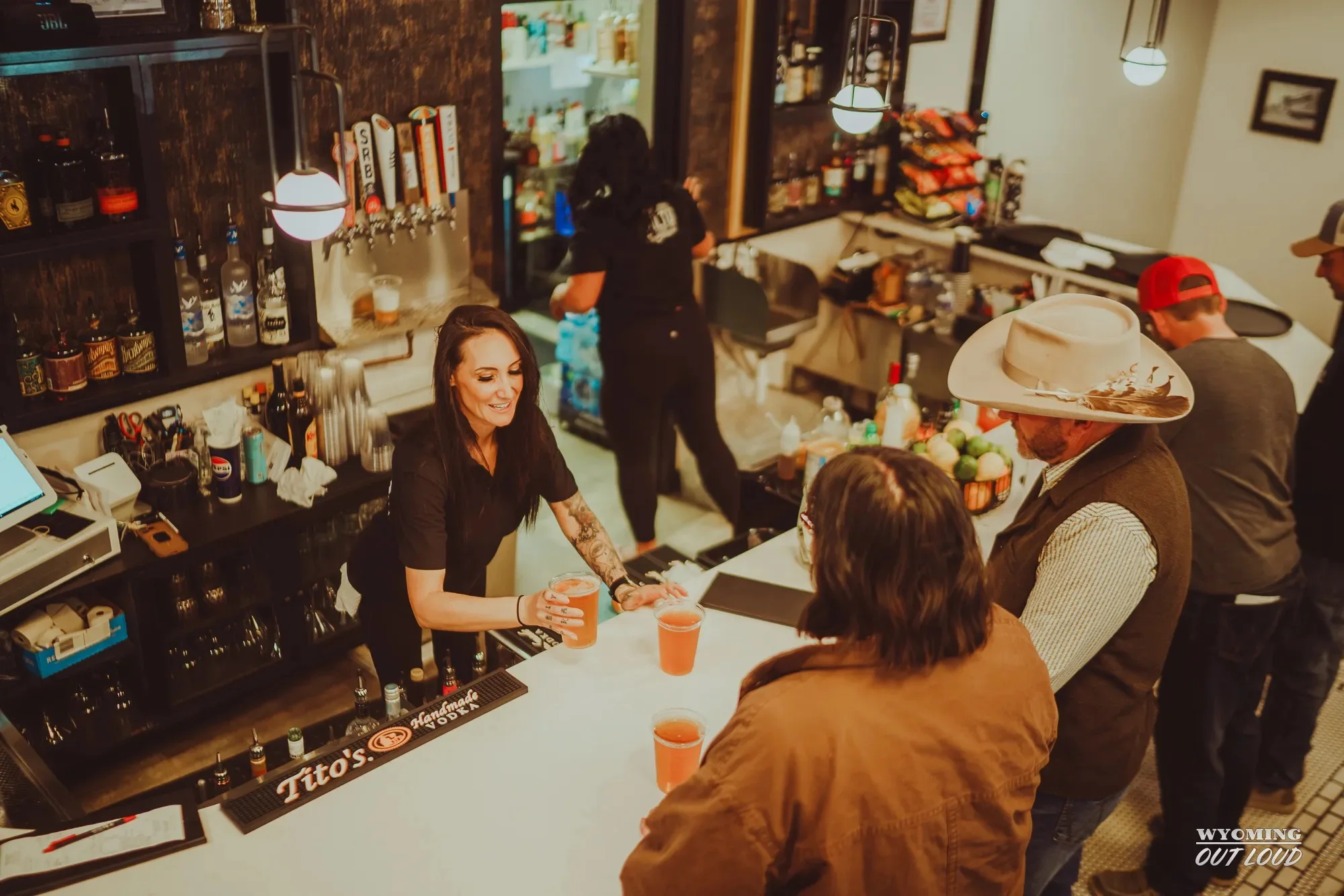 Bartender serving guests at The Rialto
