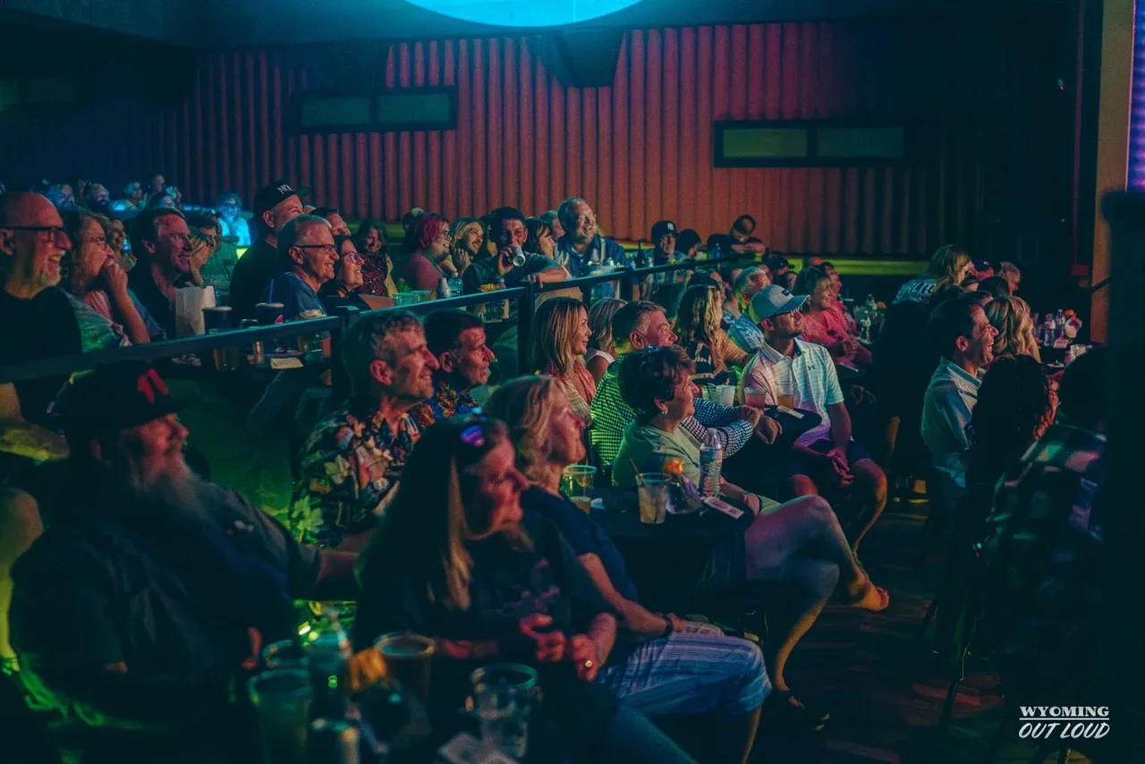 A seated crowd filling The Rialto