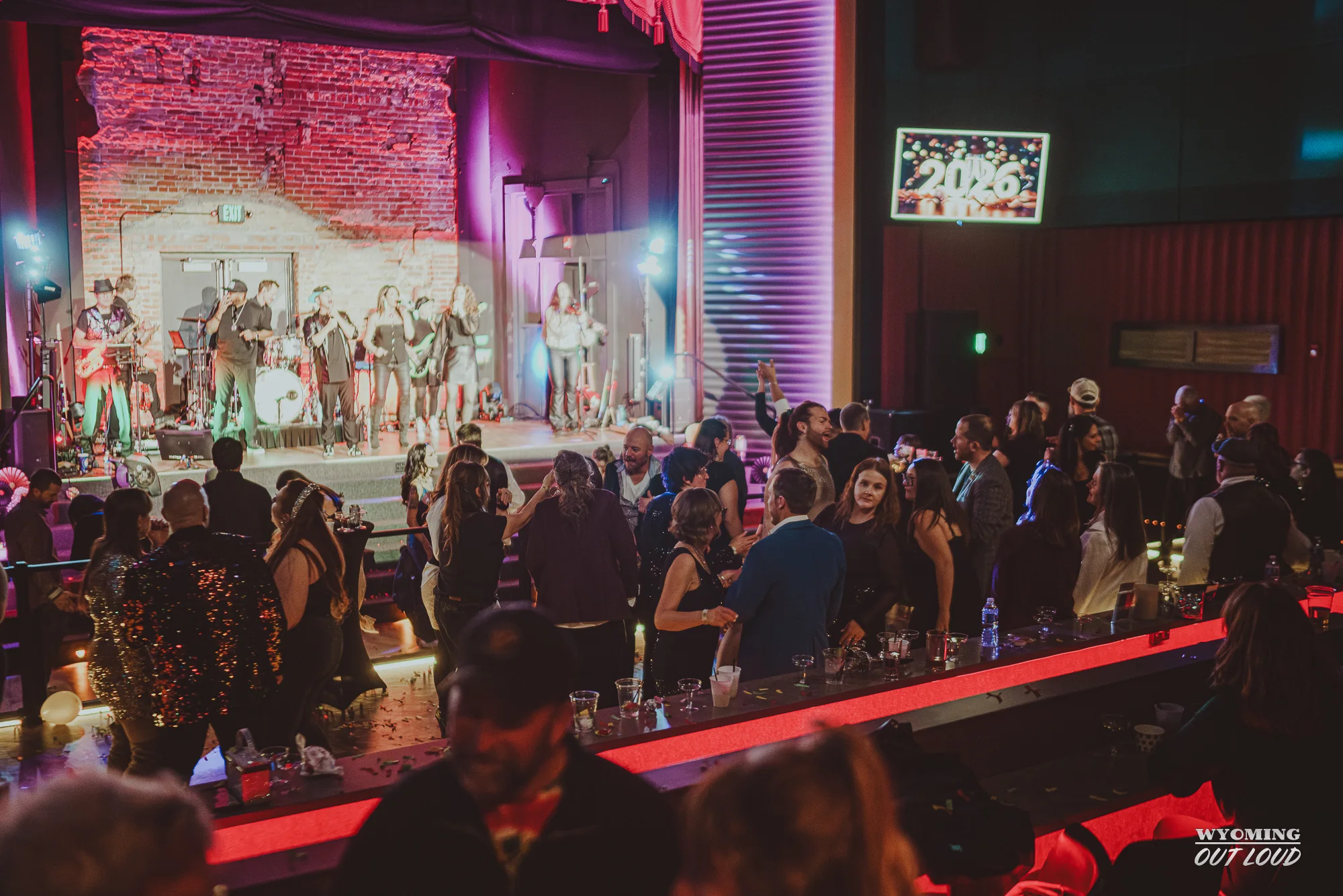 Band performing for a crowd at The Rialto
